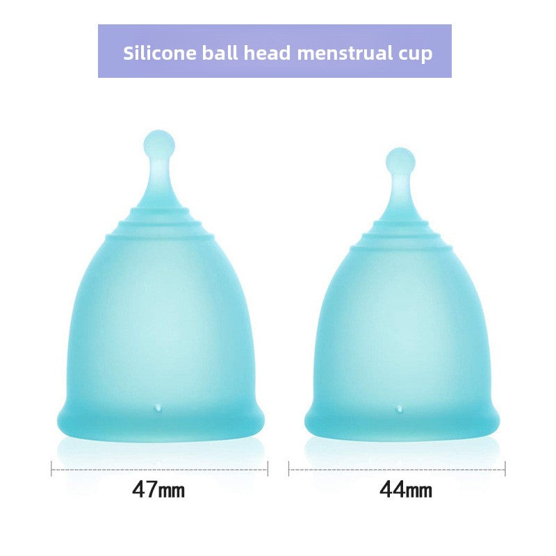 Two blue silicone menstrual cups with measurements on a white background