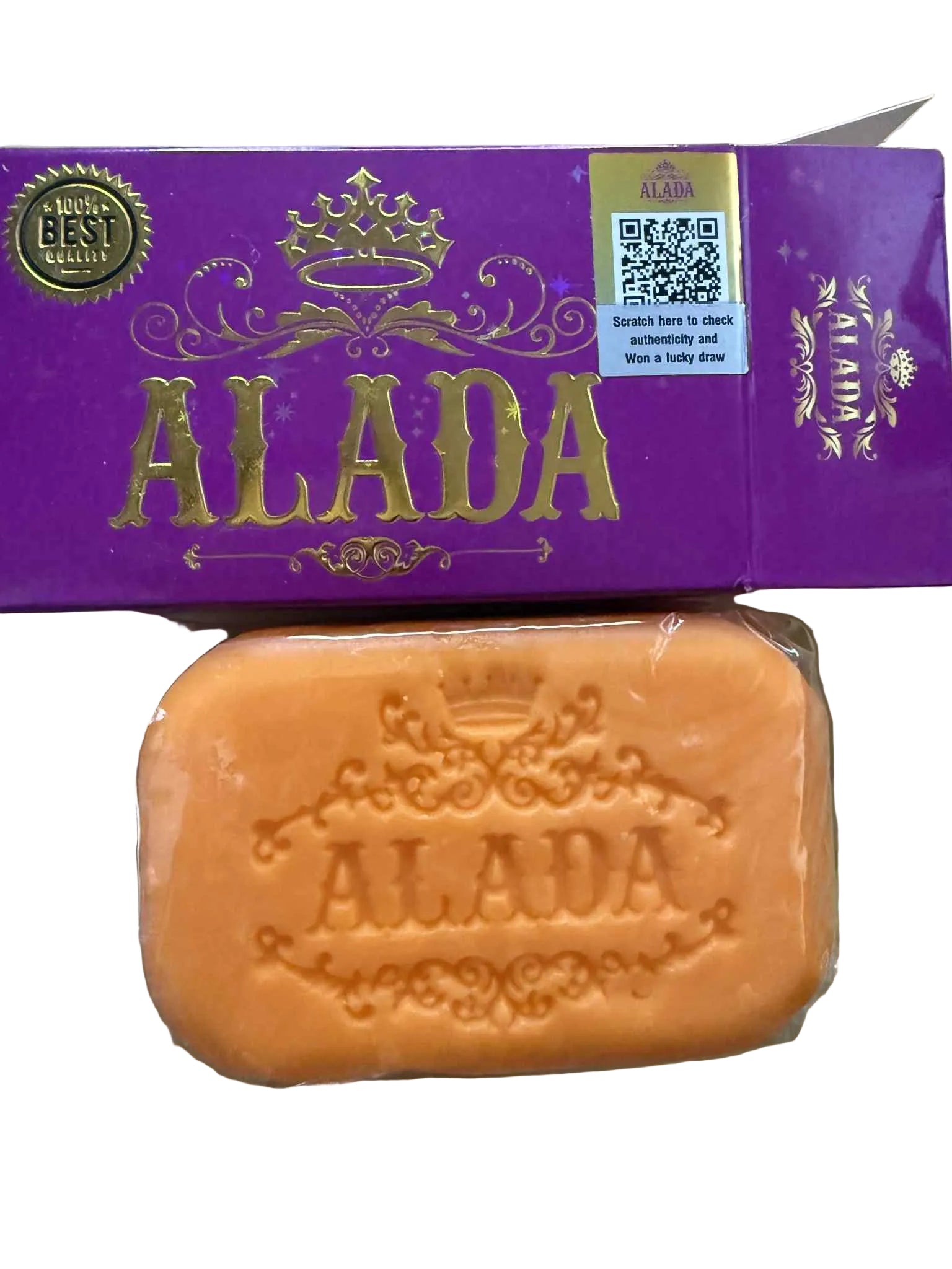 Orange soap bar with 'ALADA' branding on a wooden surface