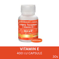 A white bottle of Myrae d-Alpha Tocopherol (Vitamin E) capsules with an orange and white label, shown alongside two orange capsules on a white background with an orange banner at the bottom.