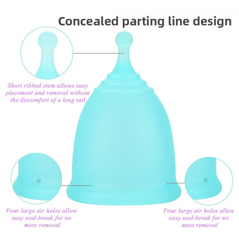 Teal menstrual cup with labeled features on a white background