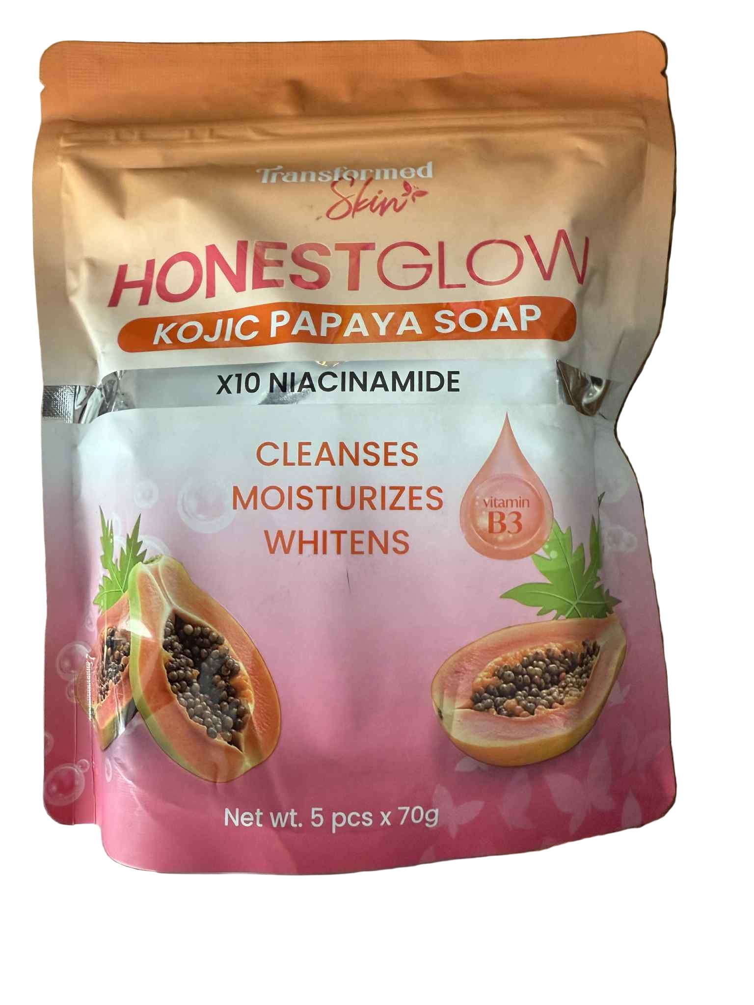 Honest Glow Kojic Papaya Soap packaging on a wooden surface