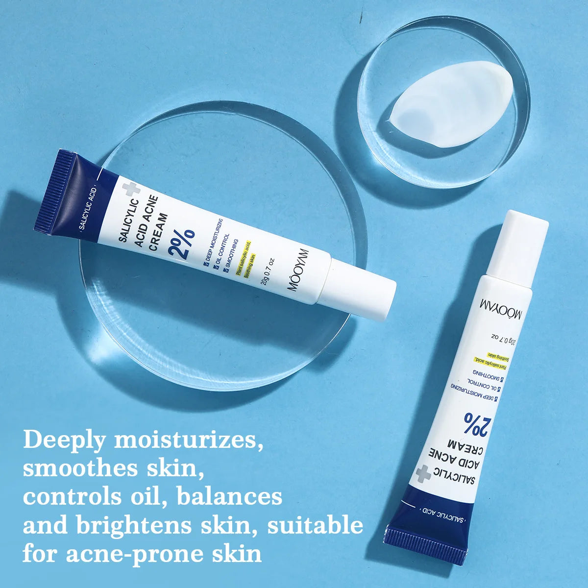 Two tubes of Mizon Salicylic Acid Cream on a blue background with product description text.