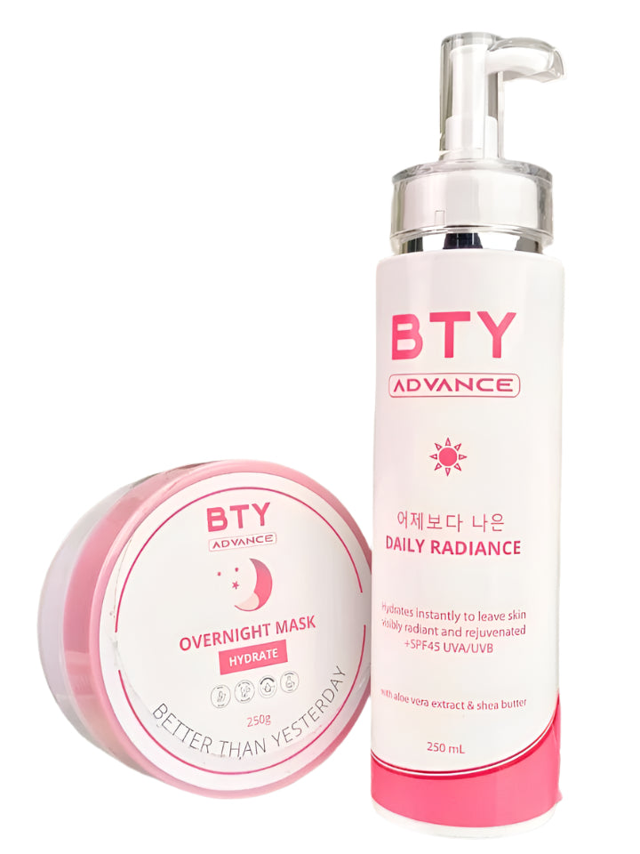 Two skincare products from BTY Advance on a white surface with green leaves in the background