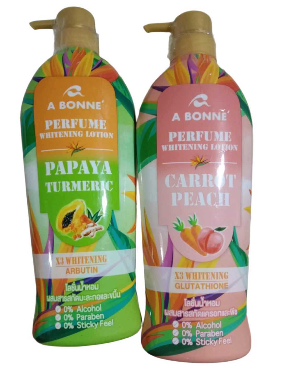 Two bottles of A Bonne perfume whitening lotion, one with papaya turmeric scent and the other with carrot peach scent, held against a neutral background.