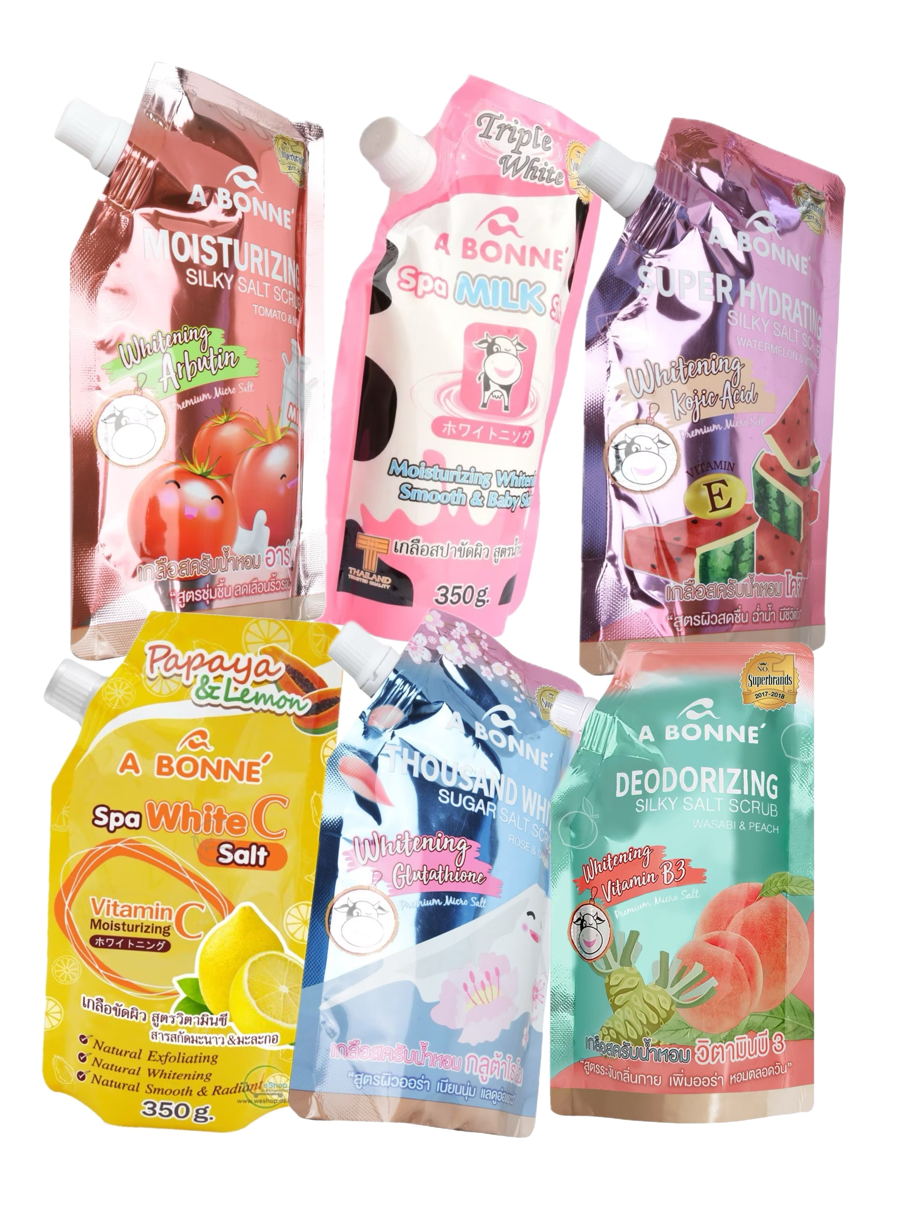 Multiple packets of A Bonne Spa Milk Salt Shower Salt Body Scrub in various flavors, each with a different color label.