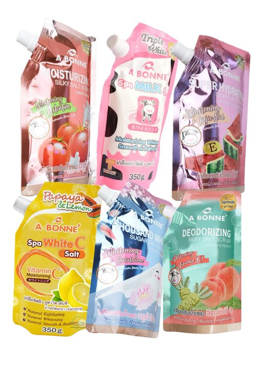 Multiple packets of A Bonne Spa Milk Salt Shower Salt Body Scrub in various flavors, each with a different color label.