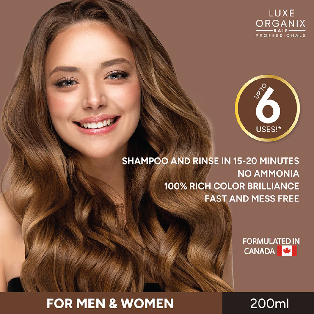 Woman with long, wavy hair smiling, with Luxe Organix hair care product packaging.