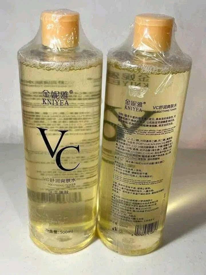 Two bottles of KNIYEA VC skincare product on a white background