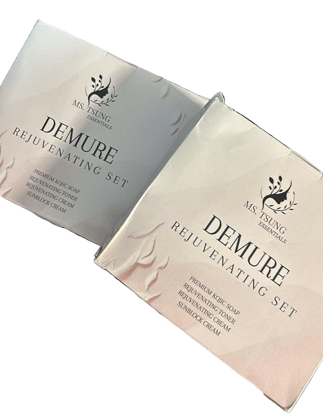 Two boxes of Ms. Tsung Essentials Demure Rejuvenating Set on a white background