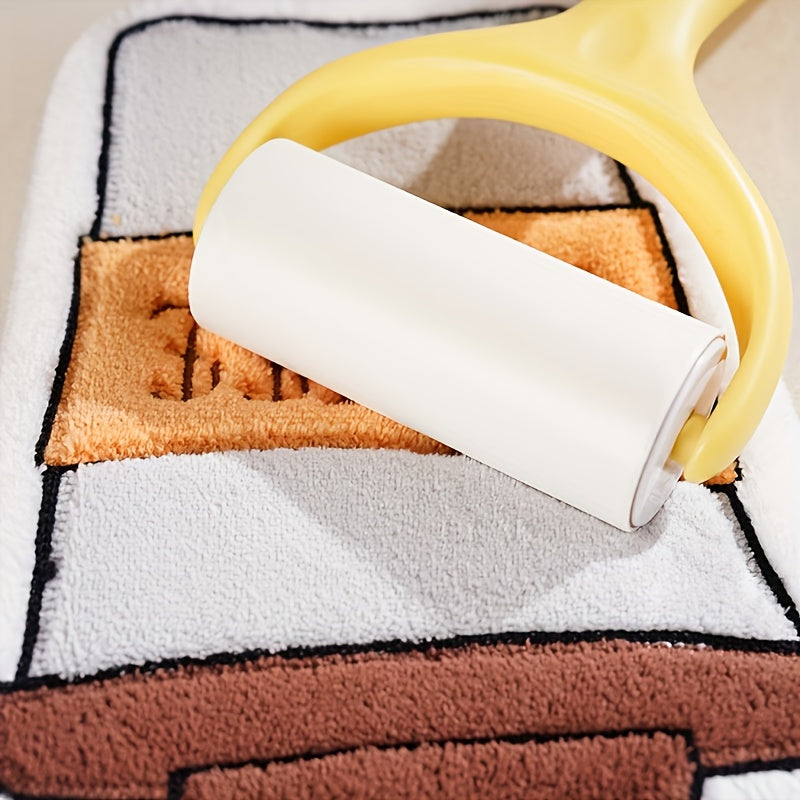 Yellow and white lint roller on a textured surface