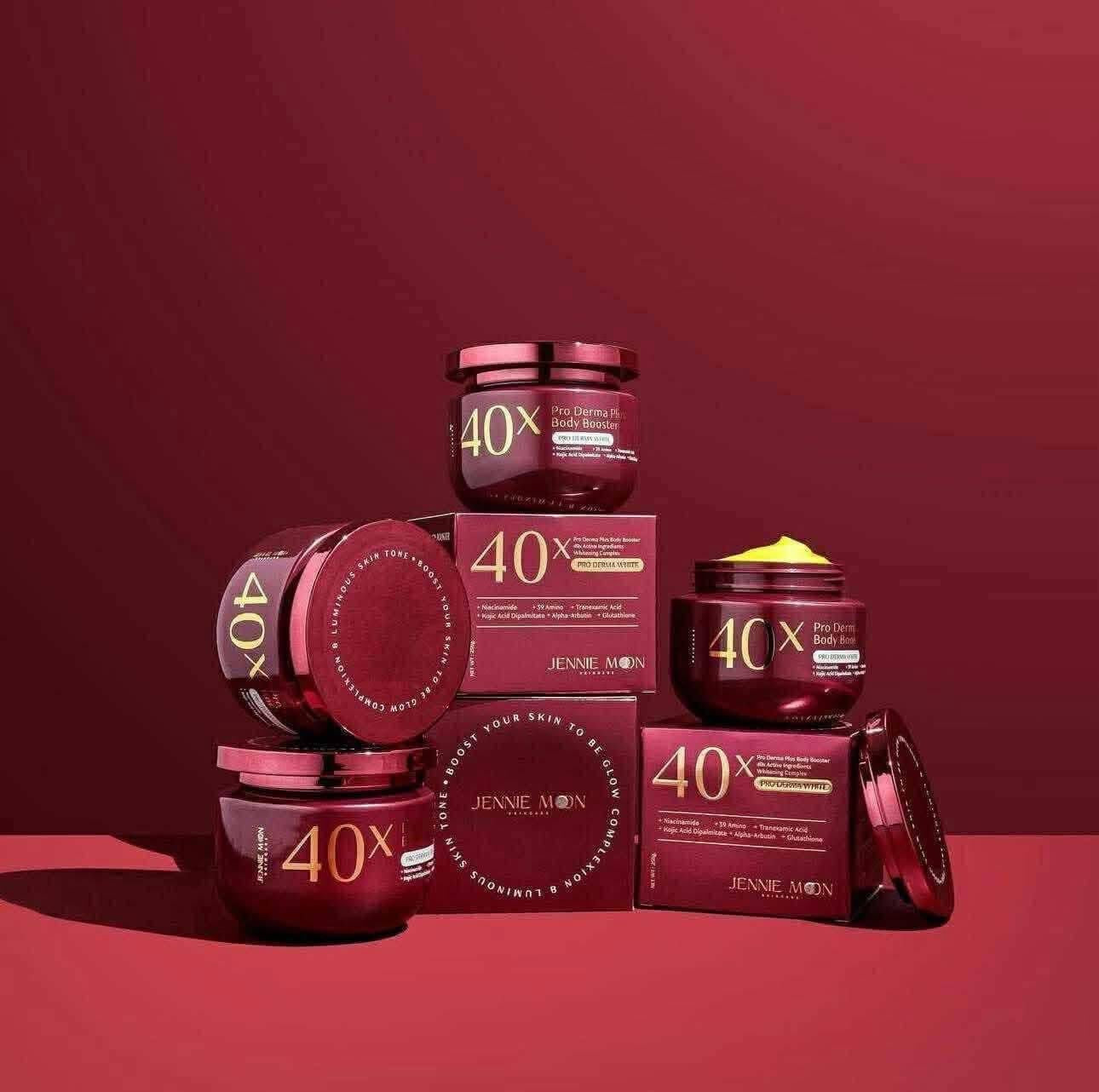 Jennie Moon skincare products with 40x magnification on a red background