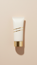 Sunscreen tube with gold-accented cap