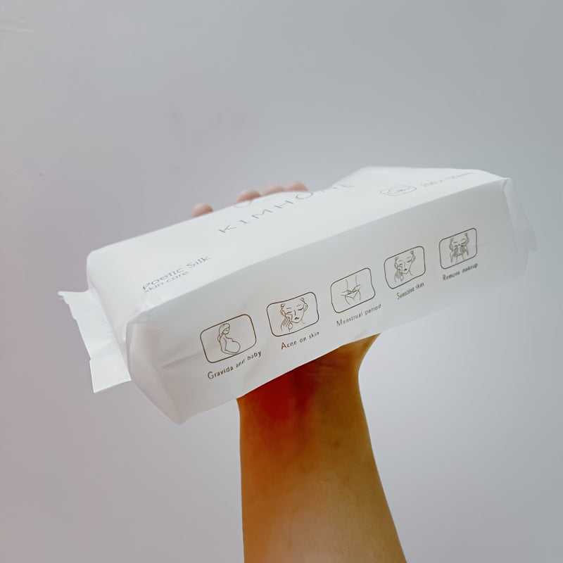 Hand holding a white box with icons on a gray background