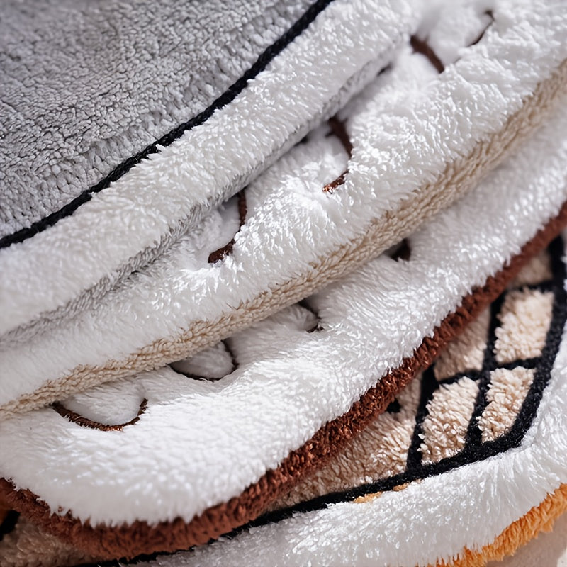 Stack of textured towels with different color patterns