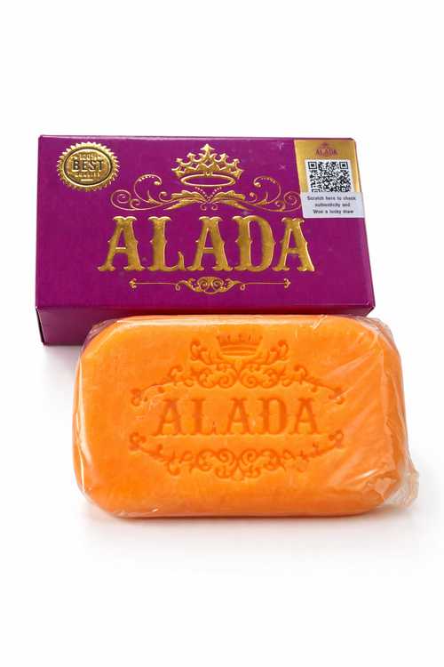 Orange bar of soap with 'ALADA' branding and a purple packaging box on a white background