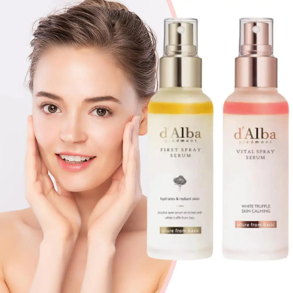 Woman touching her face with two d'Alba skincare serum bottles on a white background