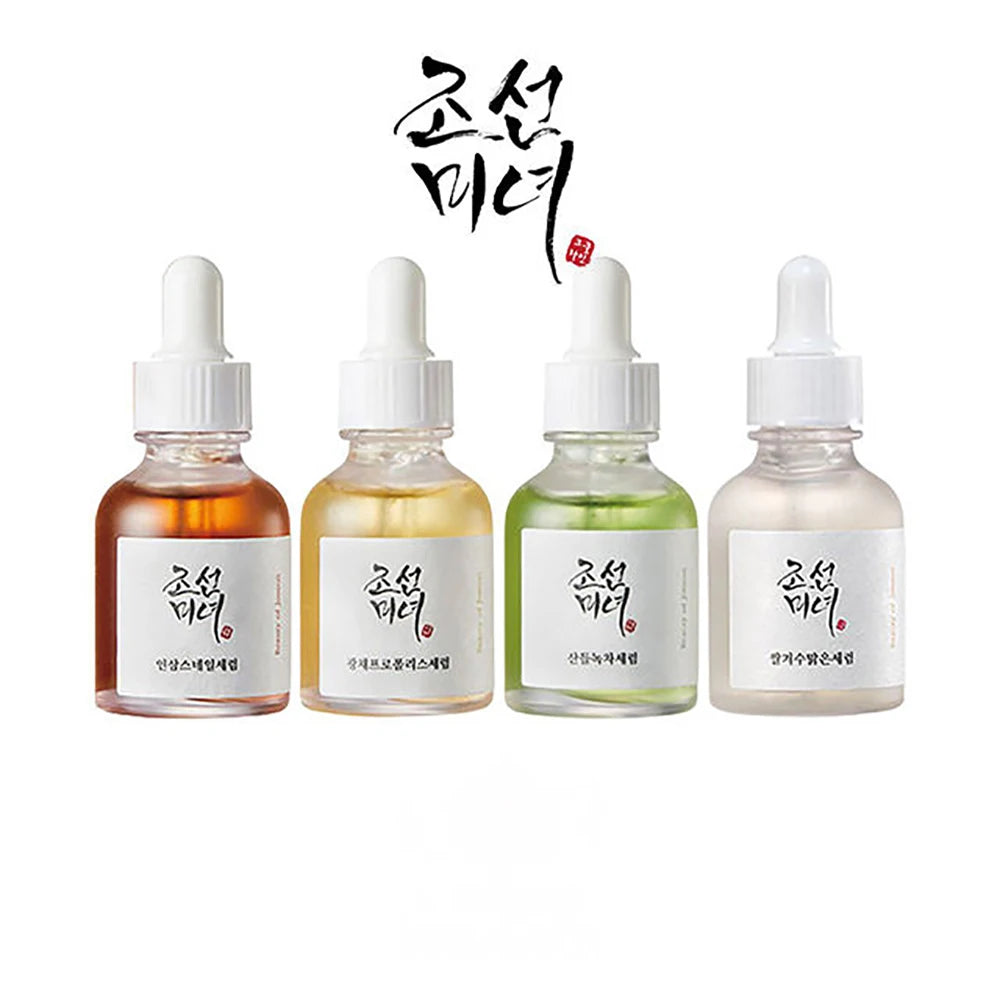 Four dropper bottles with different colored liquids on a white background, featuring Korean text.