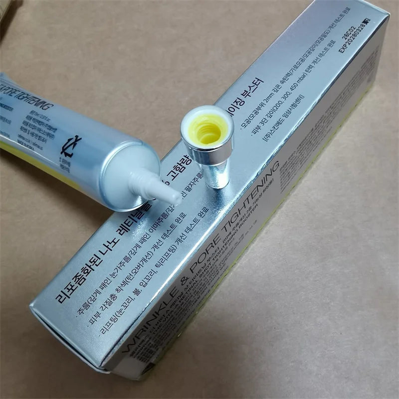 Skincare product with tube and box on a beige background