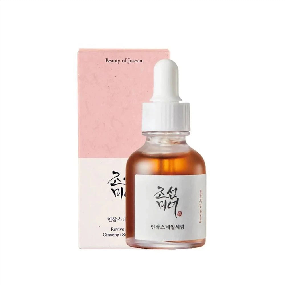 Skincare serum bottle with dropper and pink packaging on a white background