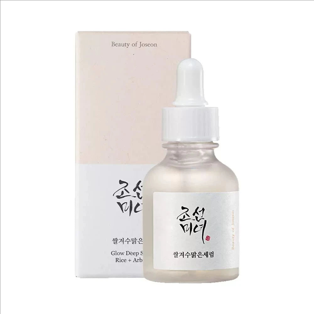 Skincare serum bottle with dropper and packaging on a white background