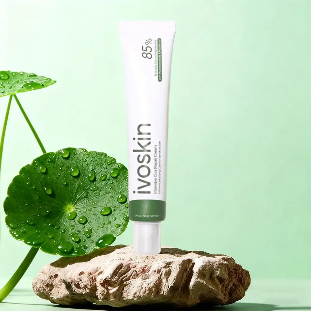 Ivoskin skincare product on a rock with a green leaf and background