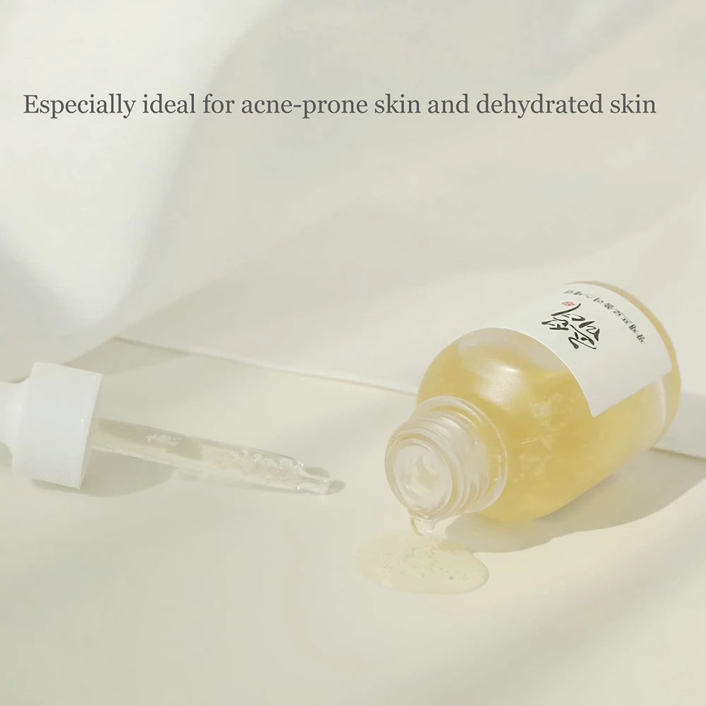 Skincare product with dropper on a light background
