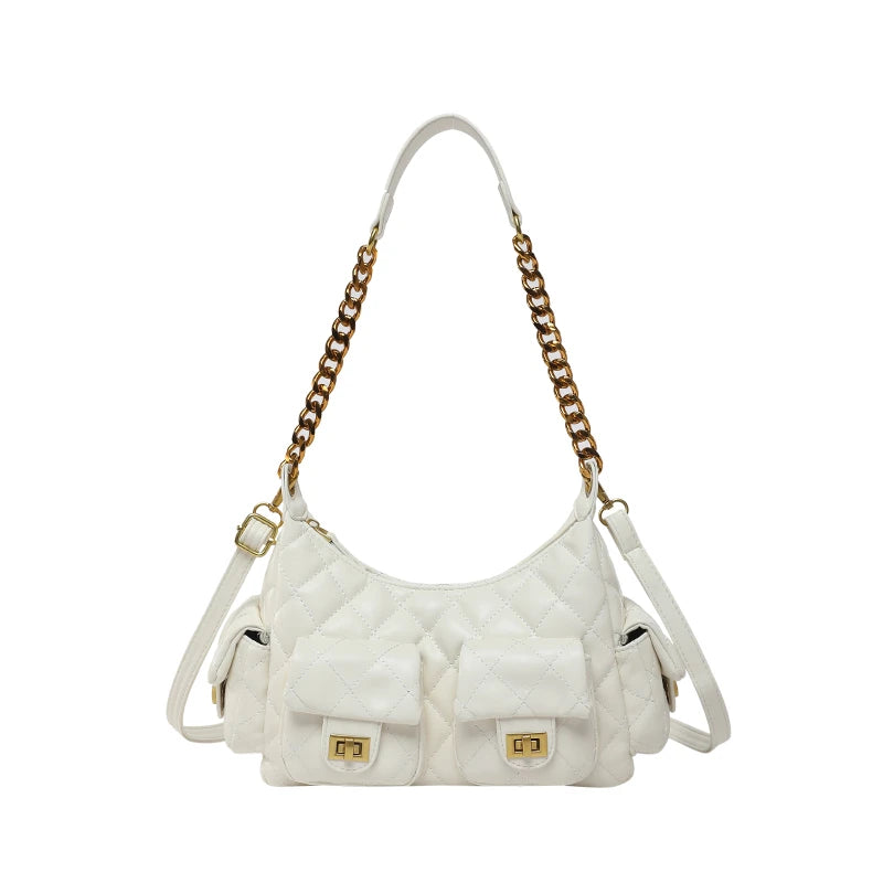 White quilted handbag with gold chain strap on a white background