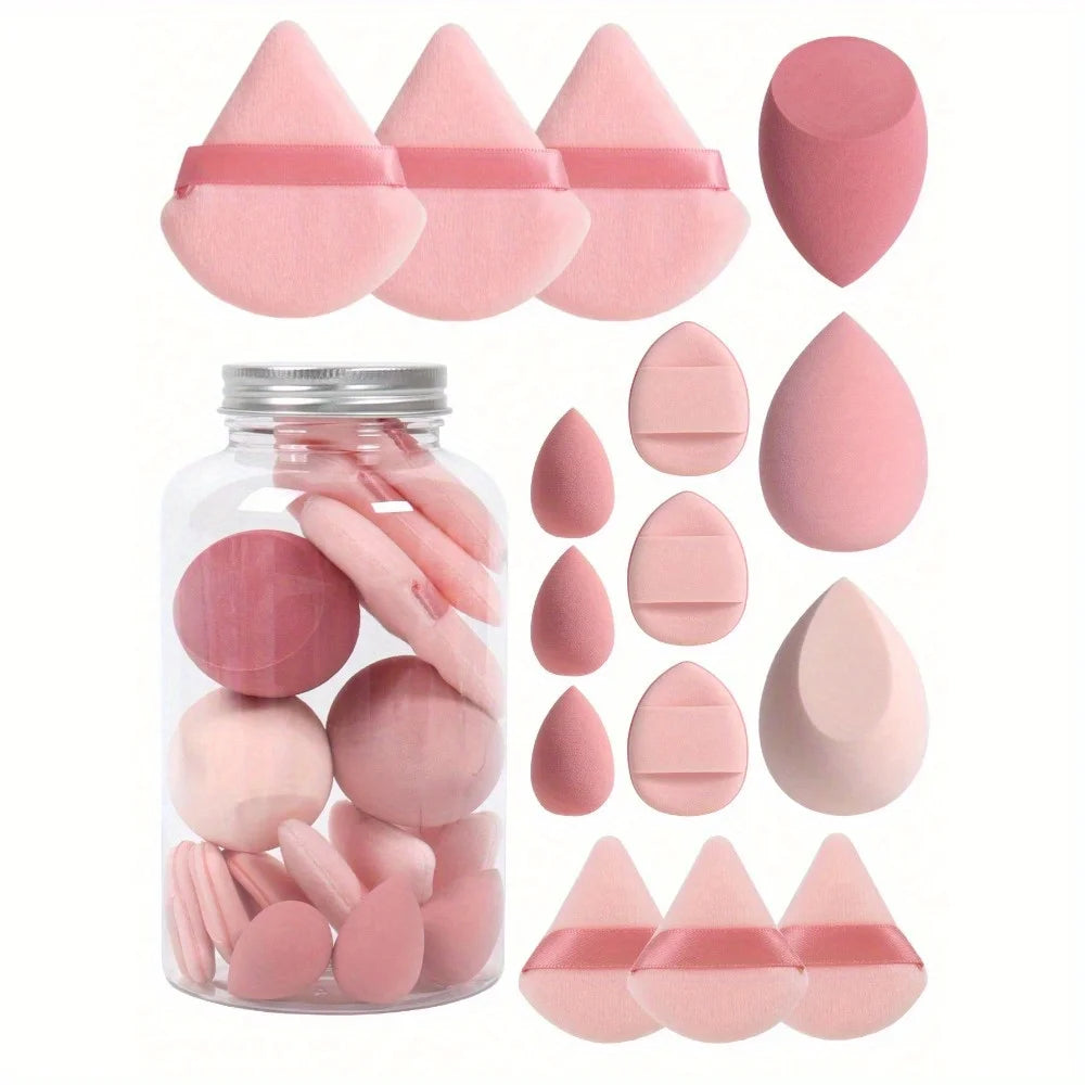 Pink makeup sponge in a jar with white background