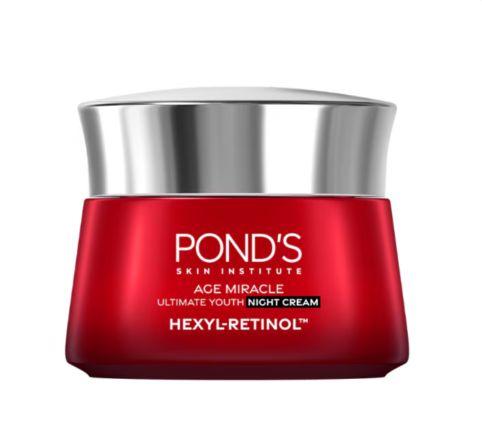 Red jar of Pond's Age Miracle night cream with silver lid on a white background