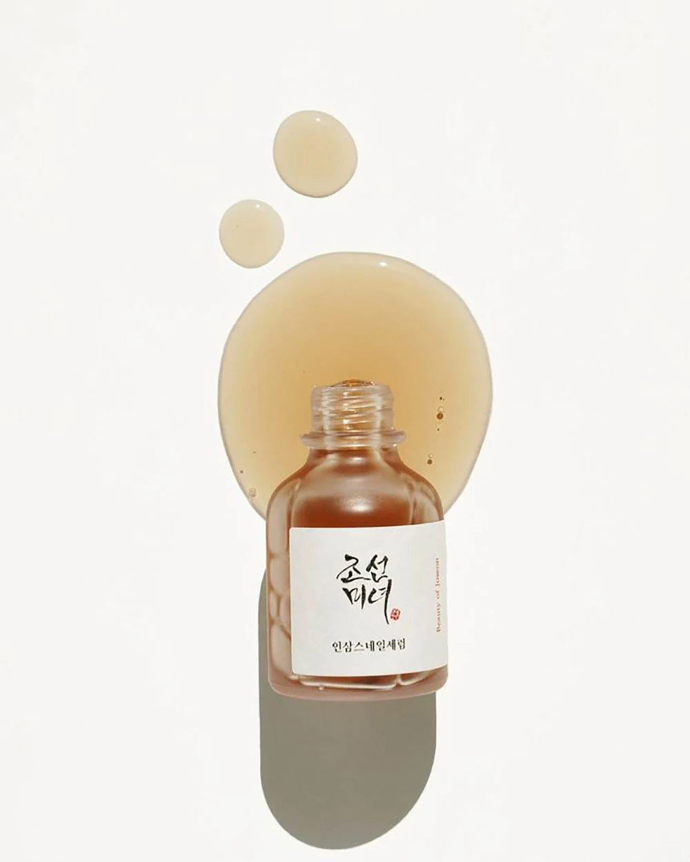 Skincare bottle with a white label on a light beige background