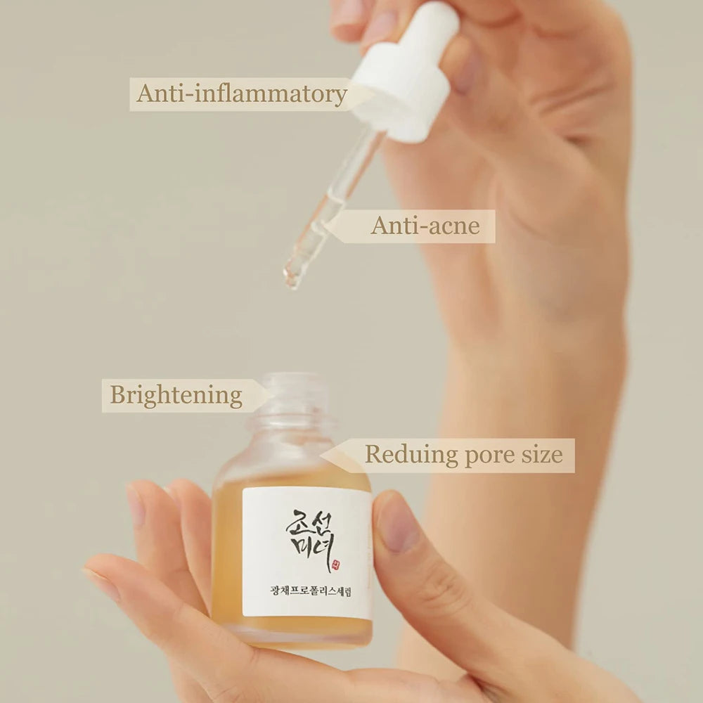 Skincare serum bottle with dropper labeled for anti-inflammatory, anti-acne, brightening, and pore reduction on a neutral background.