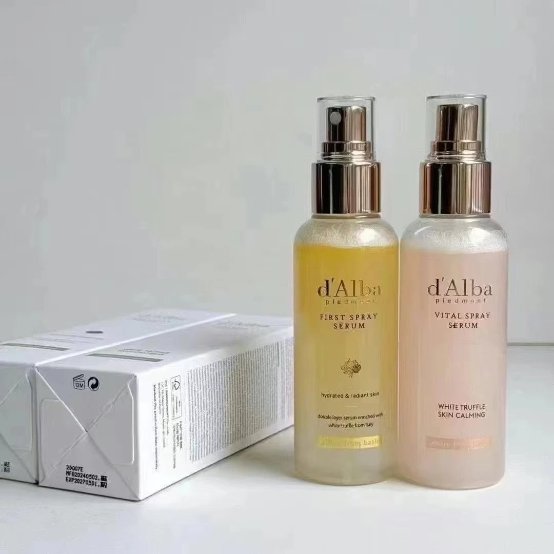 Two skincare serum bottles labeled 'd'Alba' on a light background