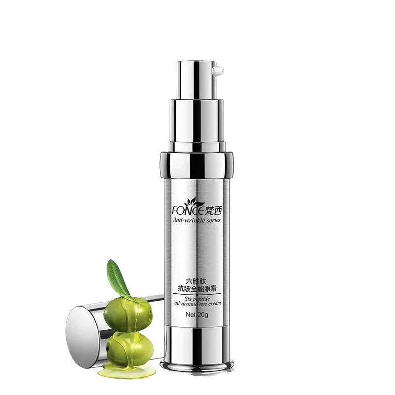 Silver skincare bottle with green leaves on a white background