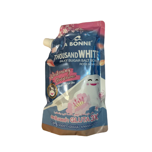A stand-up squeeze pouch of A Bonne Thousand White Silky Sugar Salt Spray, featuring a blue and pink design with a cartoon sheep illustration and a white spout cap, isolated on a white background.