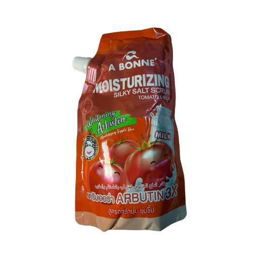A squeeze pouch of A Bonne Moisturizing Silky Salt Scrub in Tomato Liquefied form, featuring red and orange packaging with illustrations of tomatoes and a white spout cap, isolated on a white background.