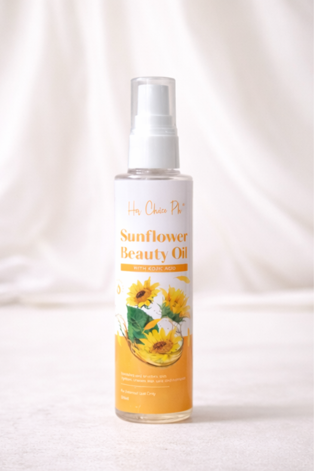 Sunflower beauty oil spray bottle on a white background
