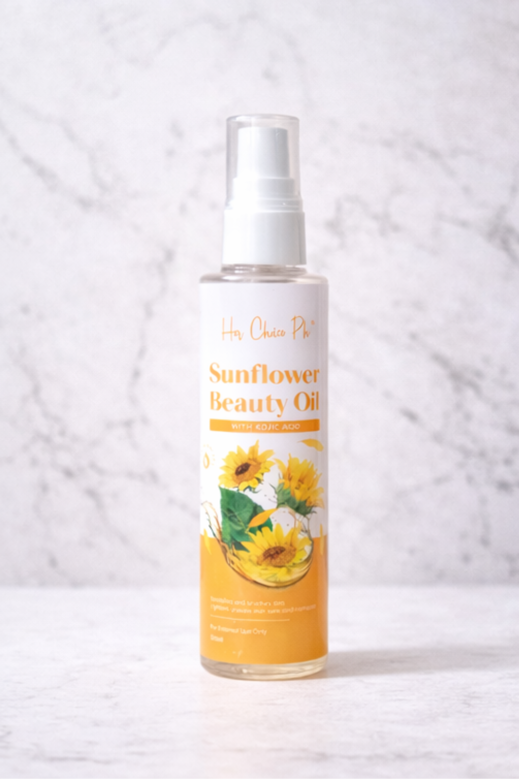 Sunflower Beauty Oil bottle on a marble background