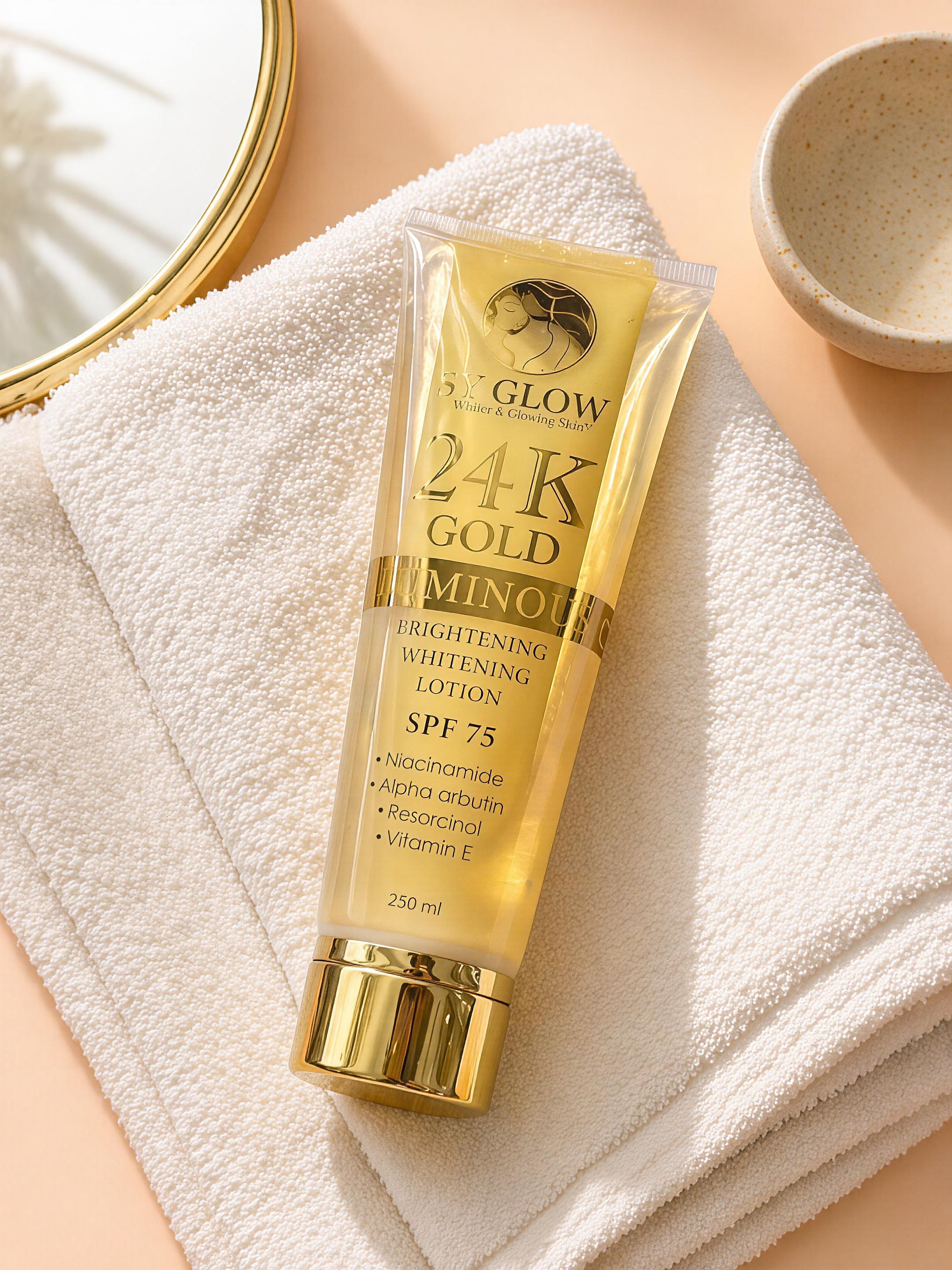 Gold tube of skincare lotion on a white towel with a neutral background