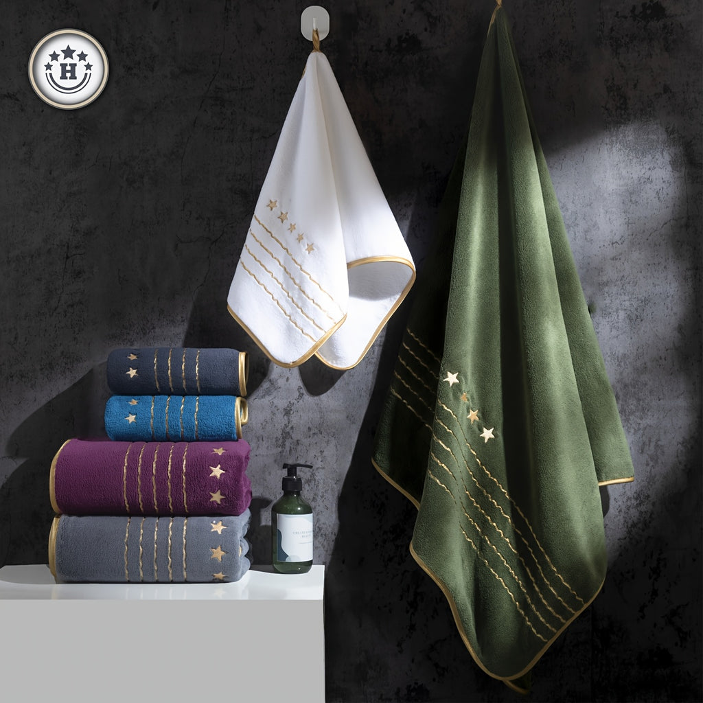 Set of towels in various colors with gold embroidery on a dark background