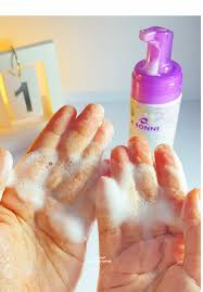 Hand washing with soap and water, with a calendar in the background